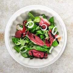 salad duck breast meat magret fresh meal food snack on the table copy space food background rustic top view