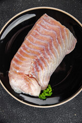 raw fish fillet seafood ready to cook natural fresh appetizer meal food snack on the table copy space food background rustic top view keto or paleo diet vegetarian  food Pescetarian