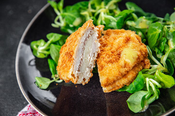 cutlet cordon bleu chicken meat, ham, cheese natural fresh appetizer meal food snack on the table copy space food background rustic top view