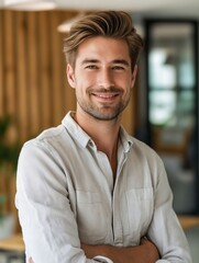 Obraz premium Young man smiling in office.