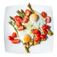 Roasted asparagus with bacon, tomatoes, mozzarella cheese and a fried egg served on a plate.