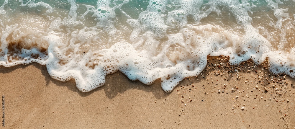 Aufkleber Detailed view of sand with a gentle wave, presenting a serene coastal scene alongside a copy space image.