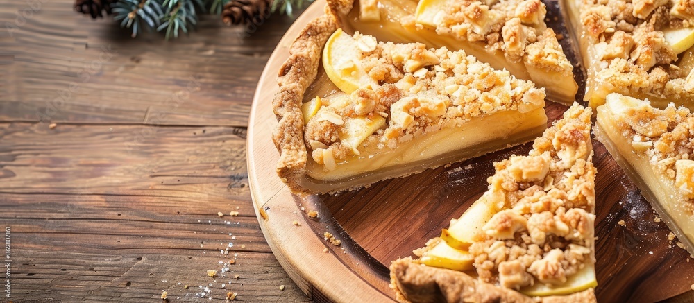 Aufkleber Top view of apple crumble pie slices on a wooden board with ample copy space image.
