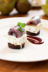 Gourmet pickled herring appetizer at fine dining Polish restaurant