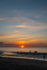 Fototapeta premium family walk, human happiness, rest by the sea, sunset over the sea, spending time together