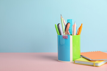 Fototapeta premium Different stationery on color background, space for text