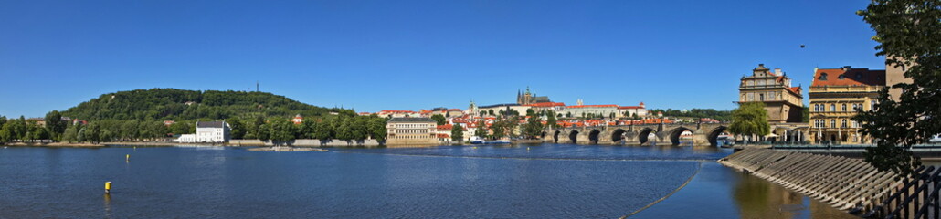 Fototapeta premium Panoramic view of Prague Castle, hill Petrin and Charles Bridge in Prague,Czech Republic,Europe 