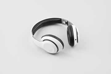 White wireless headphones isolated on white background. Monochrome. Black and white