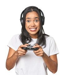 Latina gamer using a controller in studio © Asier