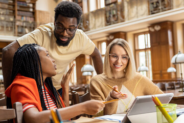Group of young people working together on the project
