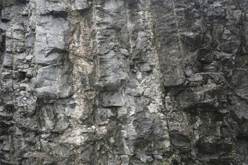 Nature and landscapes of Norway. The texture of the rock near the road. Background.
