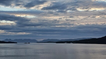 Fototapeta premium White nights in the fjords of Norway. Horizon and ferry crossing. Sky and clouds.