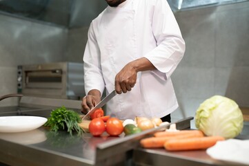 handsome african american chef at restaurant kitchen