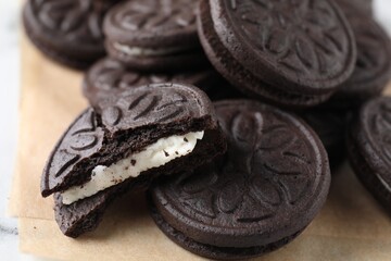 Many tasty sandwich cookies on table, closeup
