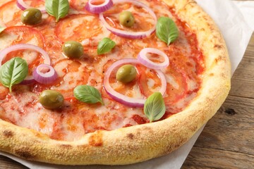 Delicious vegetarian pizza on wooden table, closeup