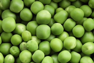 Fresh green peas as background, above view