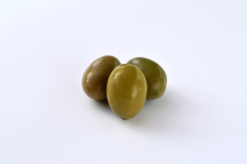 green olives on a white background close-up