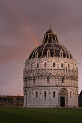 Church with a rainbow after rain and dark sky