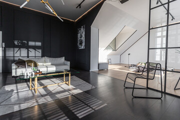 minimalistic stylish interior of luxury apartment with white stylish bedroom and dark living room....