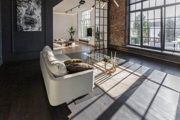 minimalistic stylish interior of luxury apartment with white stylish bedroom and dark living room....