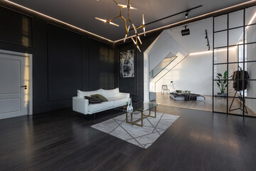 minimalistic stylish interior of luxury apartment with white stylish bedroom and dark living room....