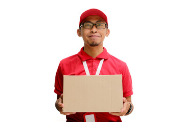 Happy Asian delivery man or courier is holding a cardboard box package parcel, smiling at the camera. Isolated on a white background, Concept of satisfaction and efficiency in delivery services