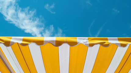 Fototapeta premium Yellow sun umbrella standing on a beach, heatwave.