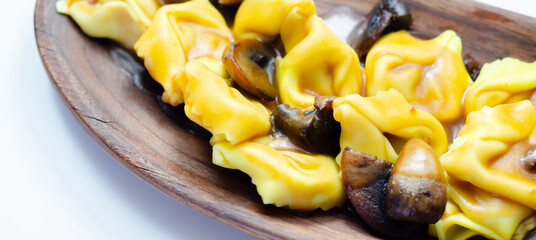 A plate of pasta with mushrooms and cheese
