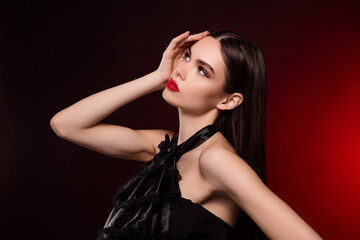 Photo of lady in black vintage dress touch face look empty space isolated red color background