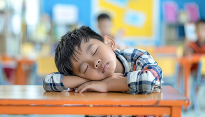 In a classroom setting, a child joyfully naps at a desk, relishing indoor relaxation