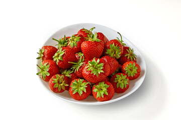 Red appetizing strawberries on a white plate isolated on a white background