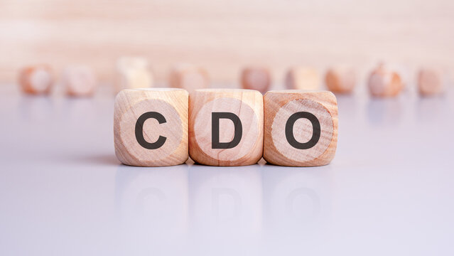 the word CDO is written on wooden cubes