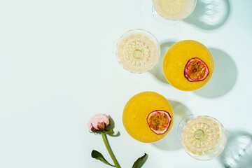 Cocktail spritz with passion fruit on blue background