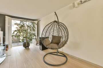 Stylish Jan Weilandlaan home interior with hanging chair, Netherlands