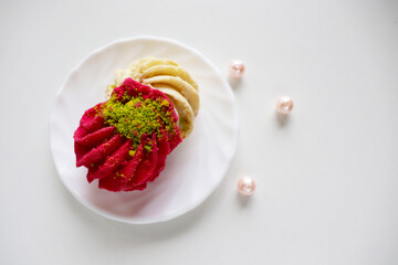 multi-colored shortbread cakes on a white plate	