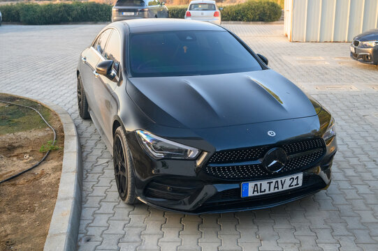 Gaziveren Cyprus 06.29.2024 Closeup of Mercedes Benz CLA AMG, black car with red sports strips. 1