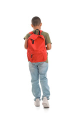 Little African-American schoolboy with backpack on white background, back view