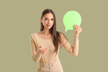 Beautiful happy young woman with speech bubble on green background