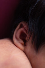 Fototapeta premium Little newborn human baby ear listening