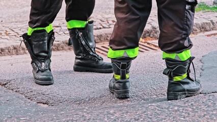 Firefighters Wearing Heavy Duty Tactical Protective Leather Boots Workwear Standing on Street after Emergency Call Rescue Action