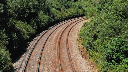 Parallel Railroad Tracks with Concrete Underlay and Crushed Stones Ballast Trackbed