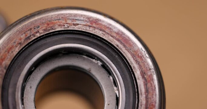 an old rusty bearing from the car's clutch system, parts of an old damaged car element