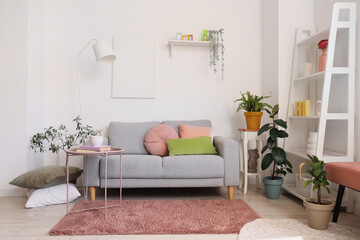 Stylish interior of living room with comfortable sofa and coffee table
