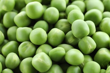 Fresh green peas as background, closeup view