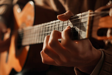 Fototapeta premium Close-Up of Guitarist Fingers Strumming Acoustic Guitar