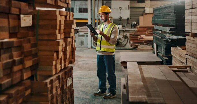 Wood, warehouse and man with tablet for check, online orders and stock control in factory. Logistics, supplier and male worker with technology for manufacturing, distribution and inventory management