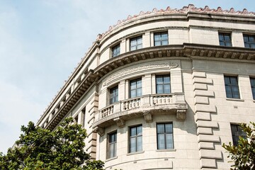 Low angle of historic building with ornate architectural details under a blue sky in Wuhan, China