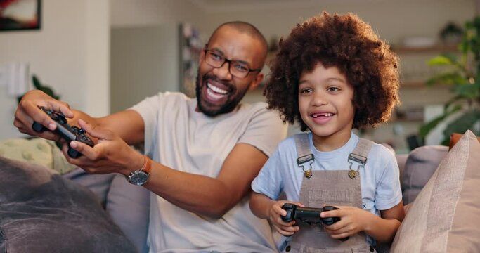 Happy father, child and playing with video games on sofa for fun bonding, leisure or weekend at home. Excited dad with son, little boy or kid on console or controller for co op gameplay at house