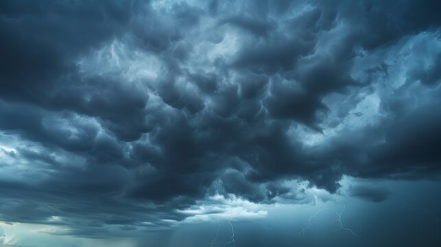 A sky filled with dark, ominous storm clouds, rumbling with distant thunder, evokes both fear and awe of nature's power.