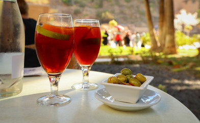 Two glasses of fresh tasty sangria served in Spanish restaurant
